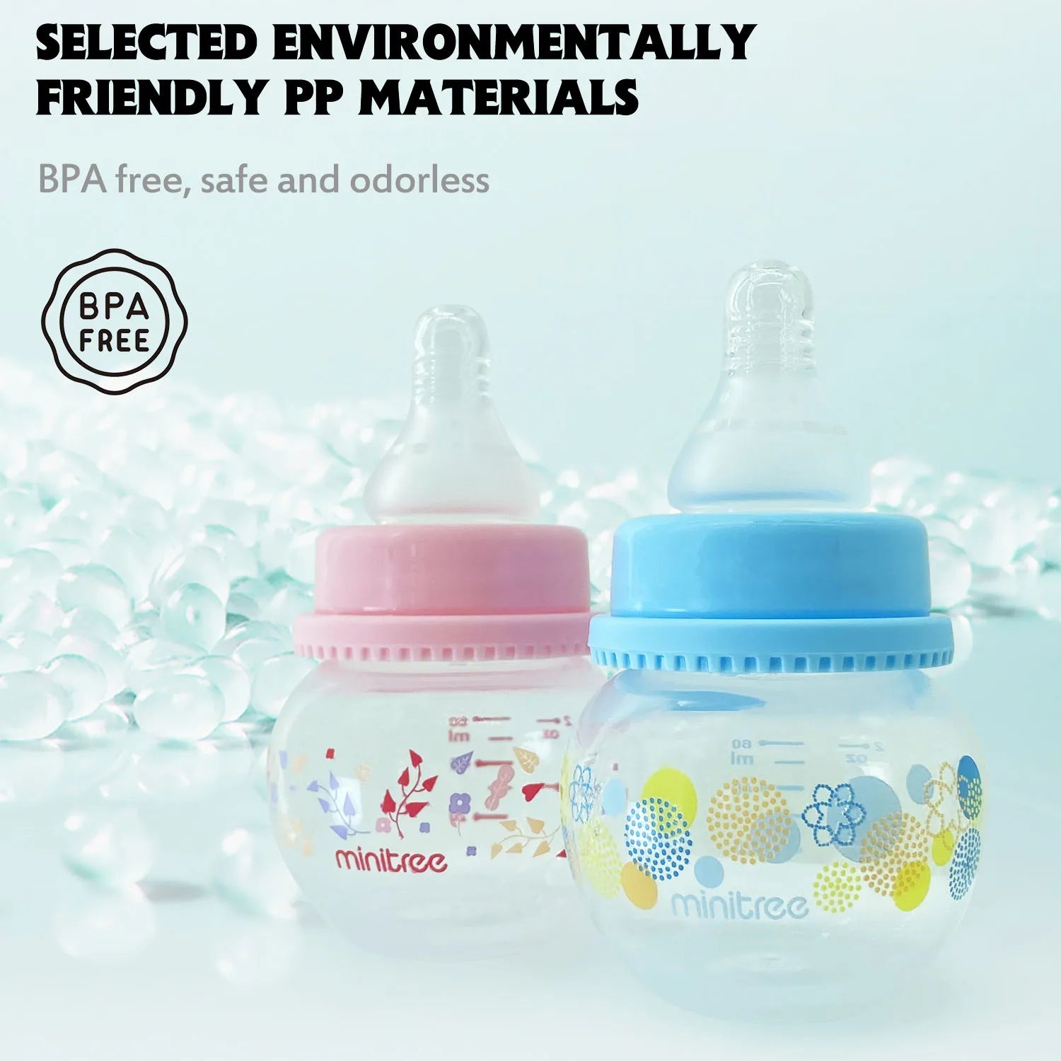 Two baby bottles with floral designs on a light blue background, featuring the brand 'minitree'.