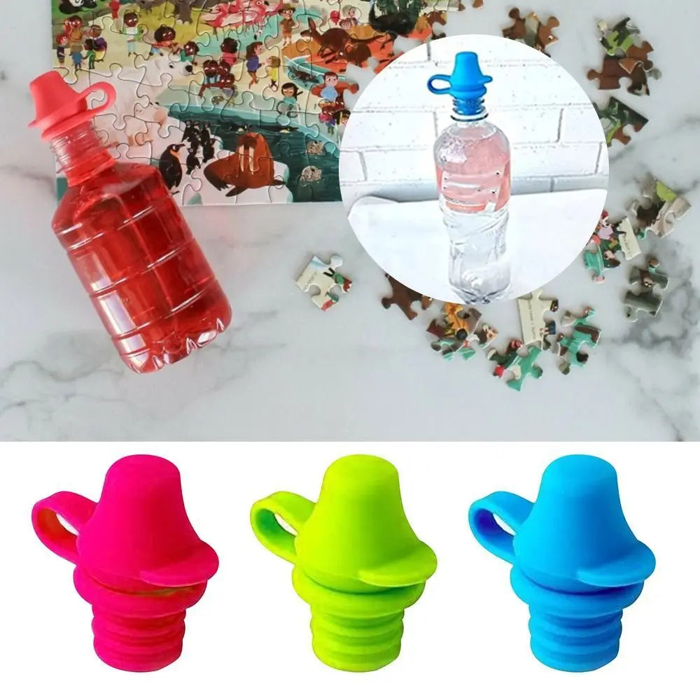 Red, green, and blue silicone water bottle covers on a marble surface with a puzzle in the background.
