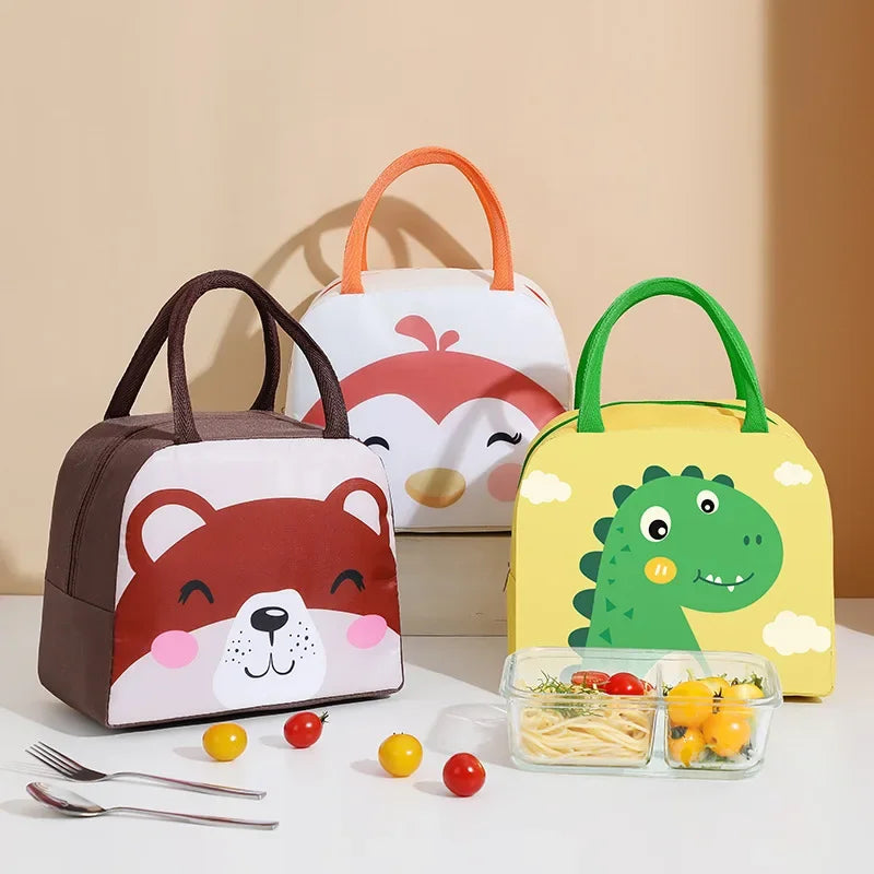 Three cartoon-themed lunch bags with food containers on a beige background