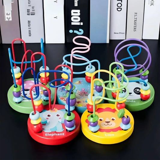 Colorful children's bead maze toys with animal characters on a black surface.
