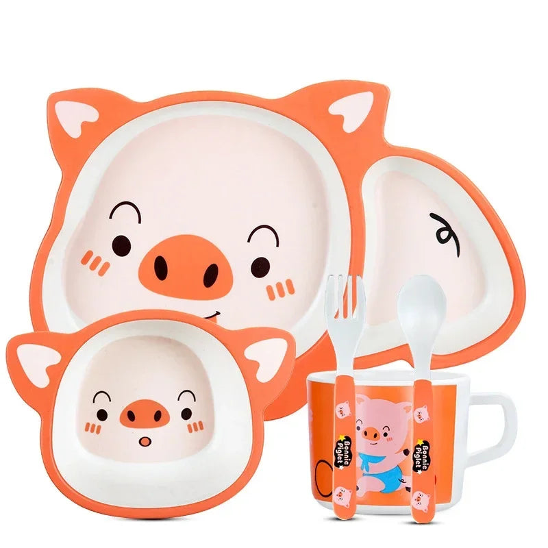 Children's tableware set with pig design on a white background