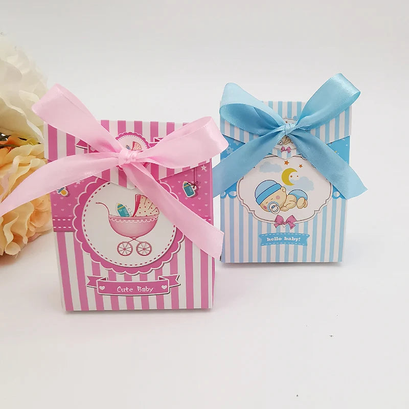 Two decorative boxes with pink and blue ribbons on a white background