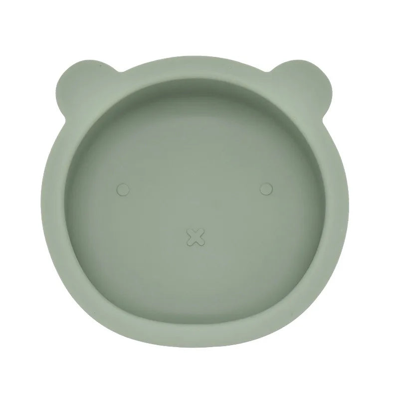 Green silicone bowl with bear ears on a white background