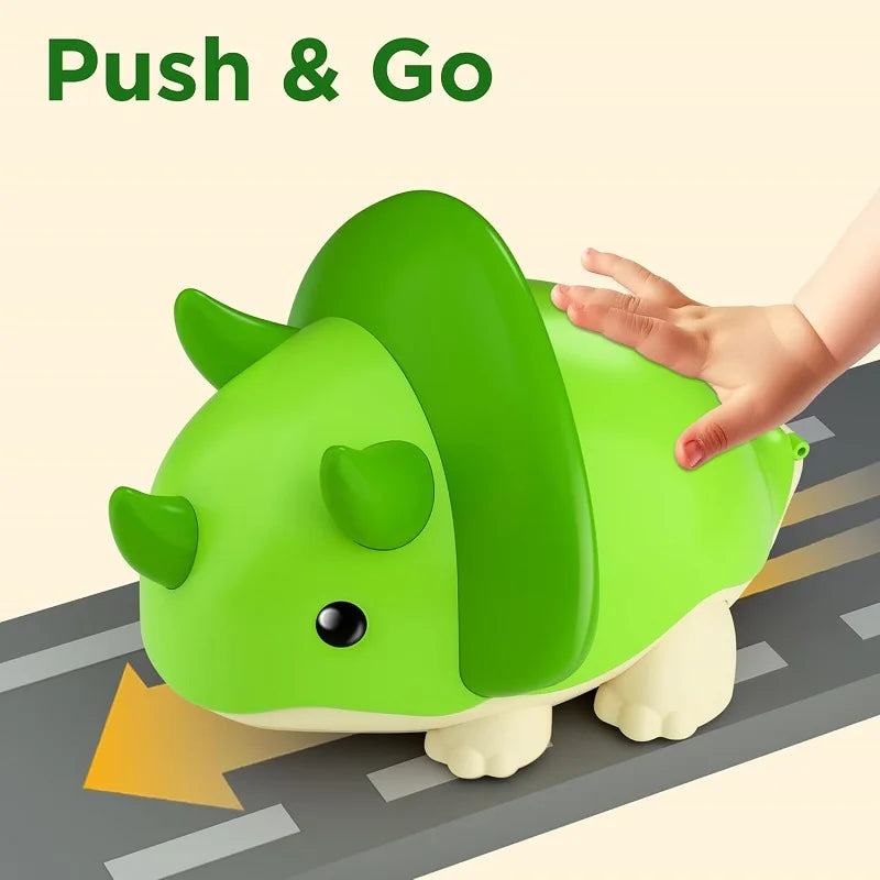 Green dinosaur-shaped toy with a hand pushing it on a road surface