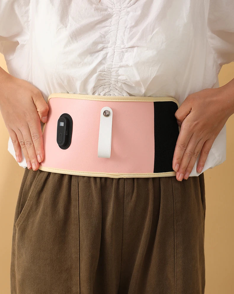 Person wearing a pink and black waist support belt against a beige background