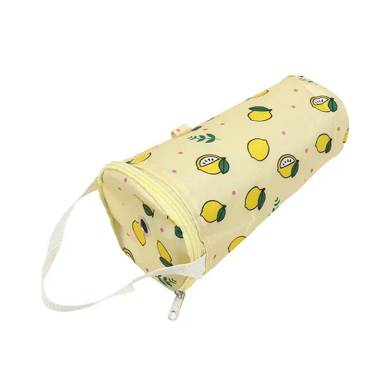 Yellow cylindrical pouch with lemon pattern on a white background