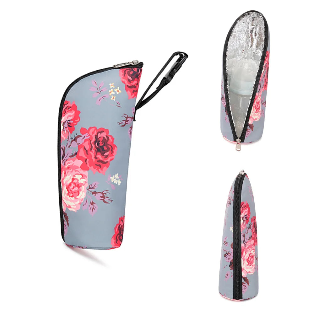 Floral-patterned cooler bag with a black zipper on a white background
