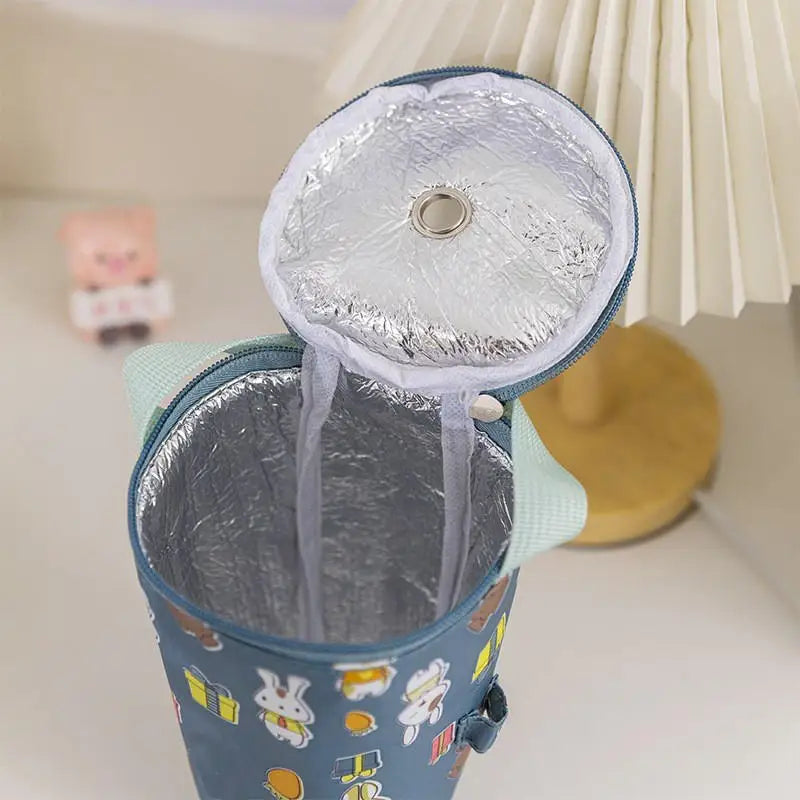 Insulated cooler bag with cartoon designs on a light background