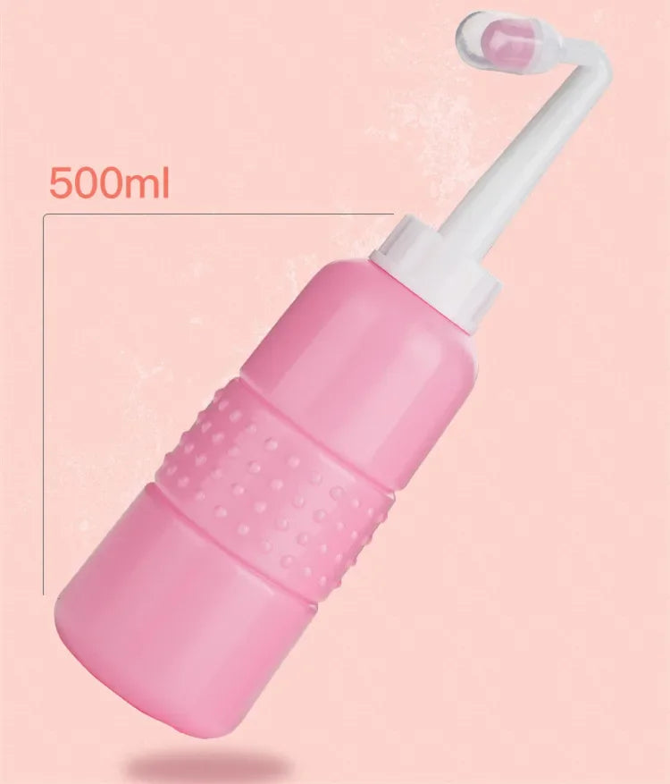 Pink bottle with a white nozzle on a pink background, labeled '500ml'.