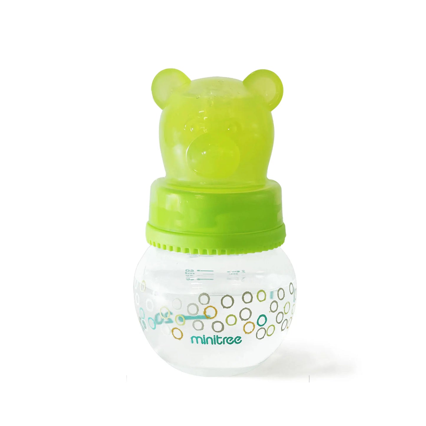 Green and clear baby bottle with bear-shaped cap on a white background