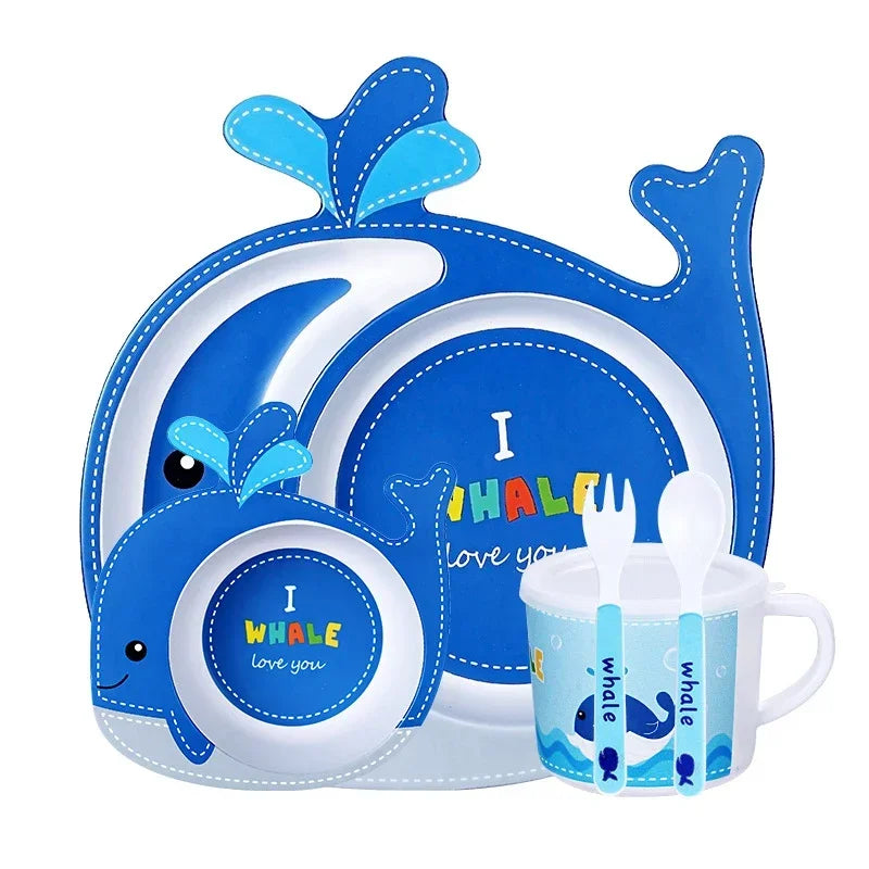Children's dinner set with whale design on a white background