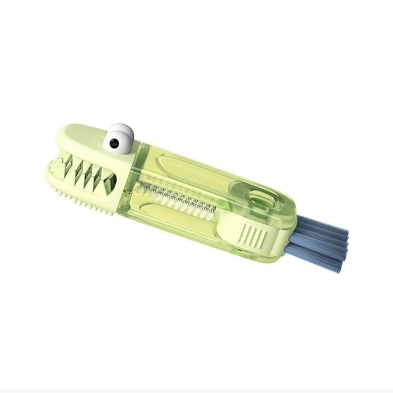Clear shark-shaped brush with a white bristle head on a white background