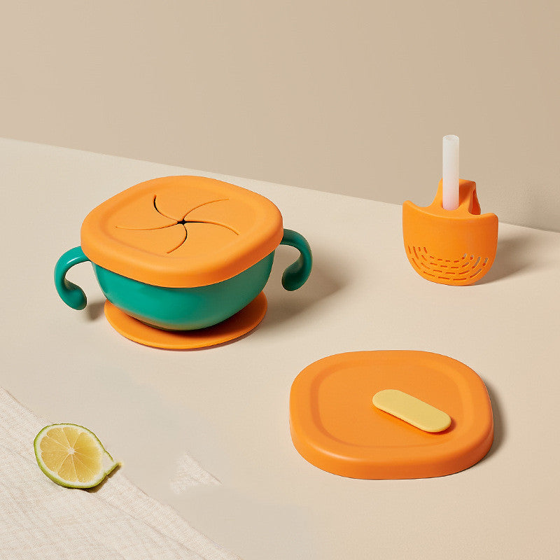 Colorful children's sippy cup and lid set on a neutral background