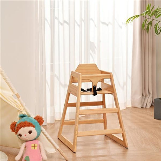 Wooden high chair in a room with curtains and a plant