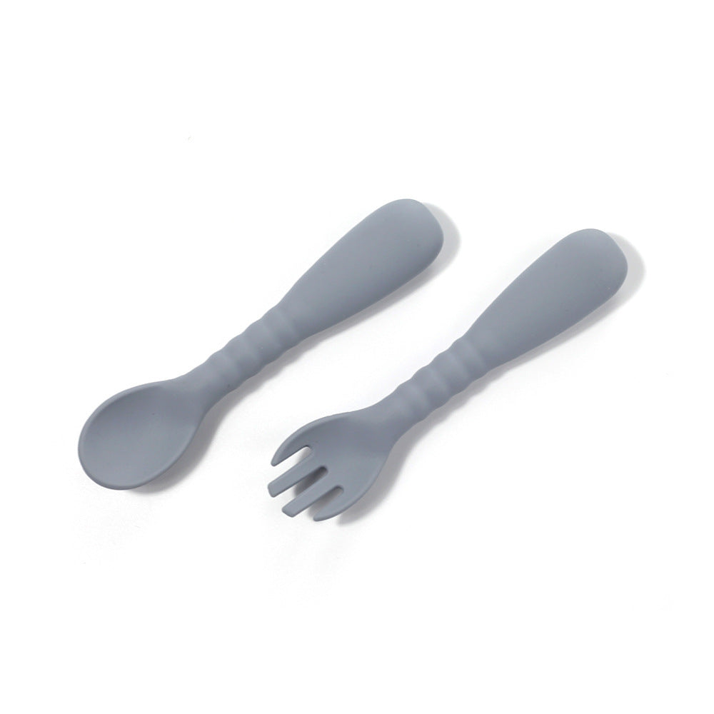 Gray spoon and fork set on a white background