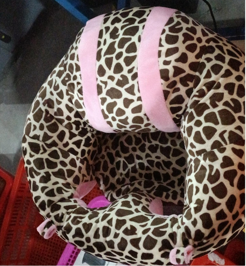 Leopard print baby seat cover with pink accents on a blurred background