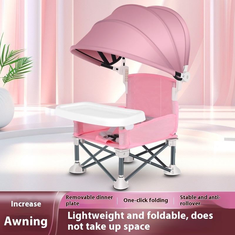 Pink baby chair with canopy in a room setting