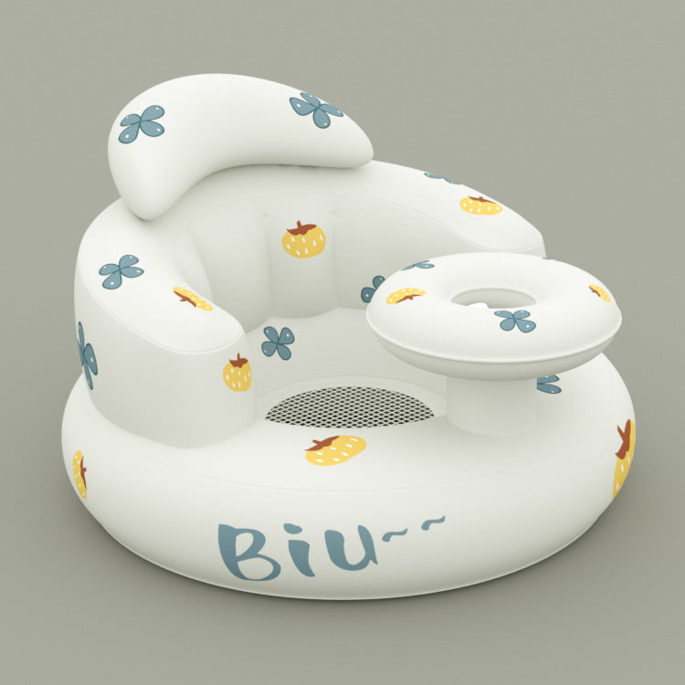 White inflatable baby seat with floral and fruit patterns on a gray background