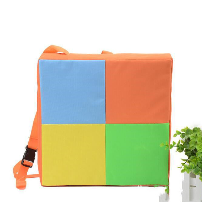 Colorful patchwork backpack with orange, blue, yellow, and green sections on a white background.