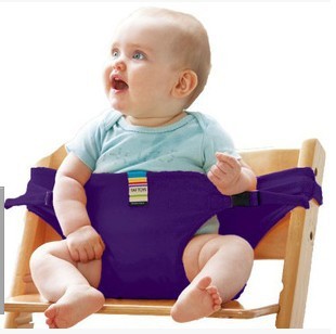 Baby sitting on a wooden stool with a purple seat cover