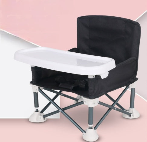 Black and white baby high chair on a pink background