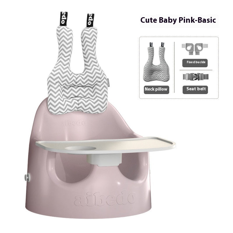 Pink baby seat with neck pillow and safety features on a white background
