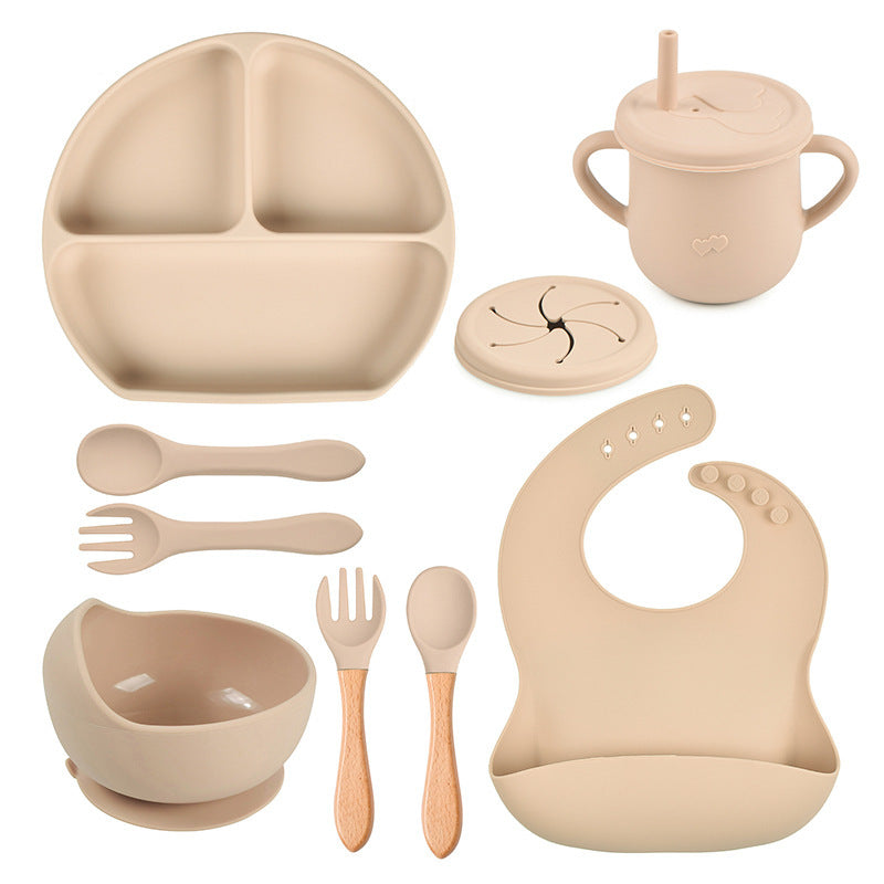 Beige baby吃饭 set including plate, cup, bowl, utensils, and bib on a white background