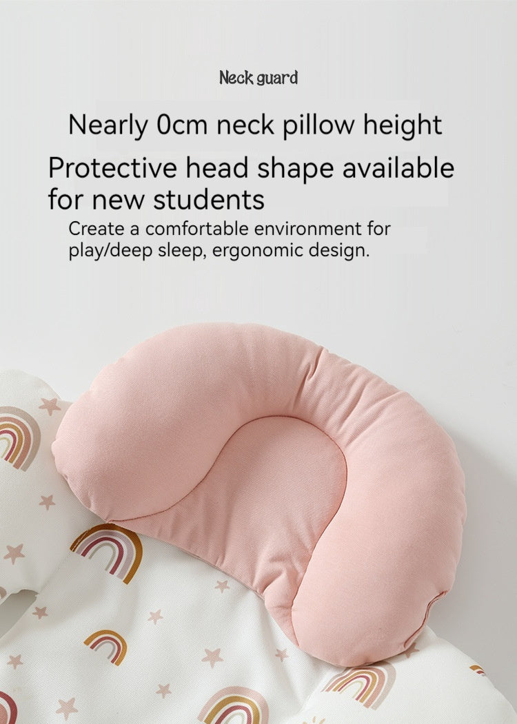 Pink neck pillow on a white blanket with rainbow patterns, text about neck guard benefits.