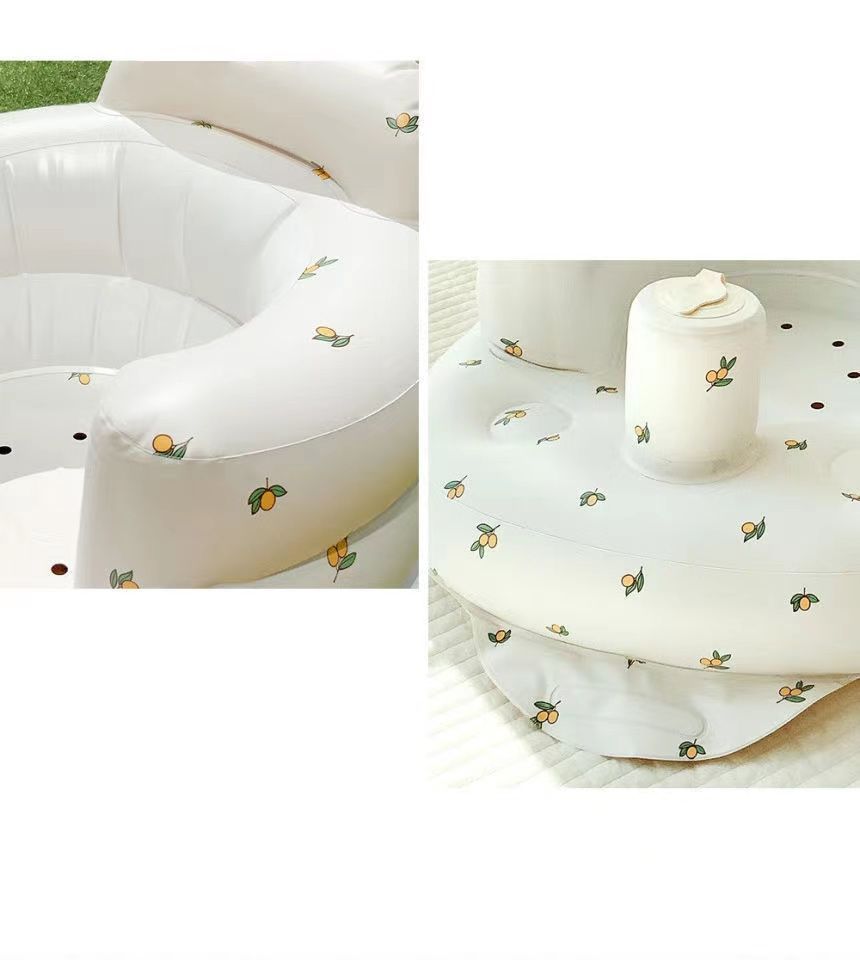 White inflatable pool with a fitted cover featuring small green and orange designs on a white background.