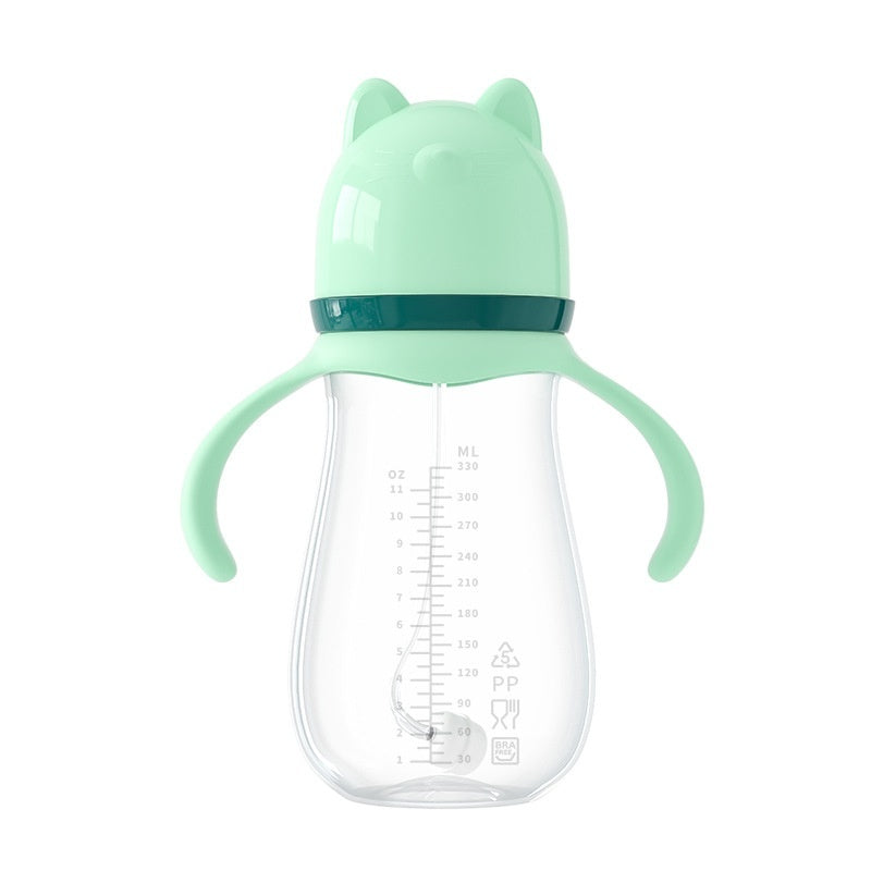 Mint green baby bottle with a cat-shaped lid on a white background