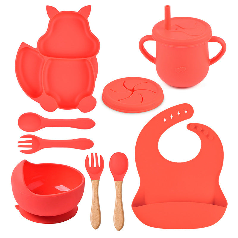 Red silicone baby吃饭 set including bowl, cup, spoon, fork, and bib on a white background