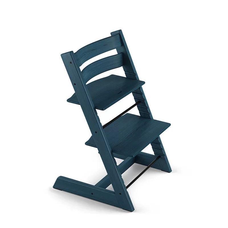 Blue wooden high chair on a white background
