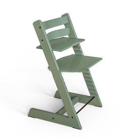 Green high chair on a white background