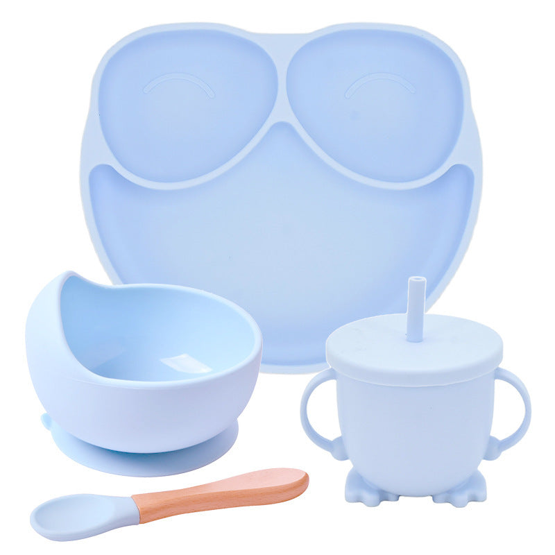 Set of blue silicone baby feeding items including a tray, bowl, cup with straw, and spoon on a white background.